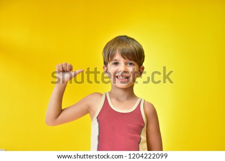 portrait of a boy on a yellow background