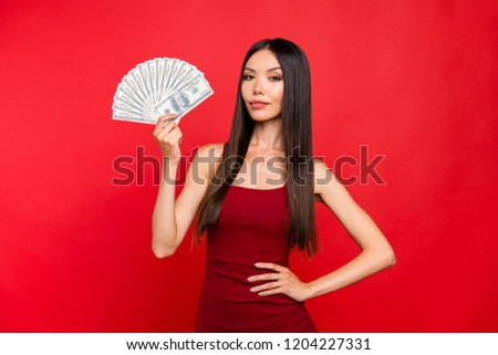 Portrait of elegant graceful glamour attractive pretty well-groomed charming lady she look at camera hold her pile stack of money hold hand on waist isolated on red bright background
