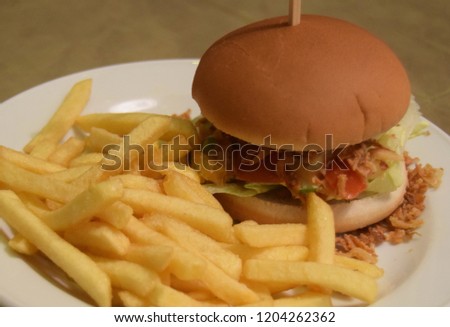 Plate of french fries and a vegetarian hamburger