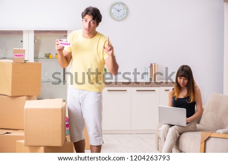 Young pair moving to new flat with fragile things 