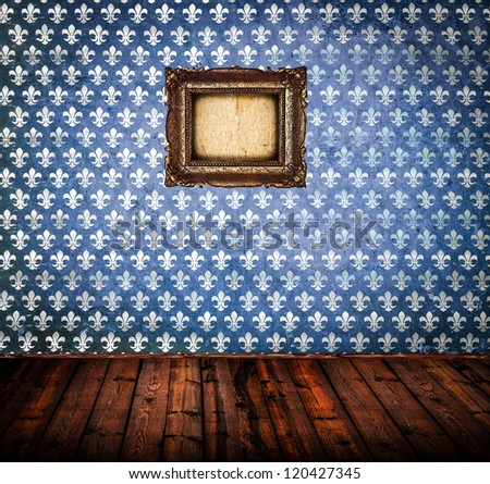 Interior of empty antique room woth wooden floor and blue damask wall with frame