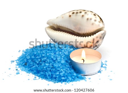 Sea salt with candle and seashell isolated on white background