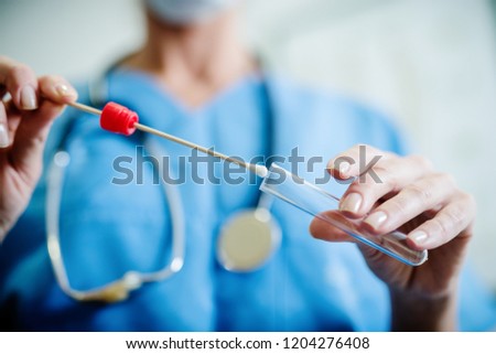 Close up of doctor with sample from sick woman. Selective focus on sample. Royalty-Free Stock Photo #1204276408