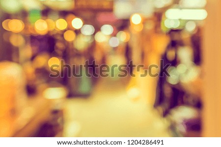 Vintage tone abstract blur image of  Indoor Day Market with bokeh for background usage .