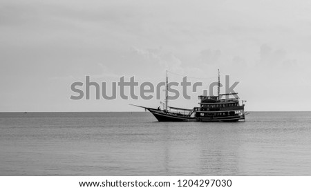Fishing boat of the sea black and white picture.