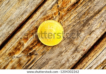 Crypto currency Gold Bitcoin, BTC, macro shot of Bitcoin coins on wooden background,  bitcoin mining concept