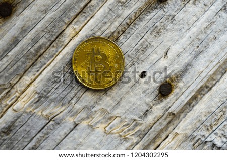 Crypto currency Gold Bitcoin, BTC, macro shot of Bitcoin coins on wooden background,  bitcoin mining concept