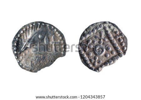 Anglo Saxon silver Sceat coin front and reverse sides of the early 8th century cut out and isolated on a white background Royalty-Free Stock Photo #1204343857