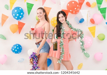 Young Beautiful Happy Fun in Party Christmas, Studio, Confetti, Celebration