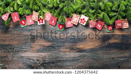 Christmas gifts Advent calendar on wooden background