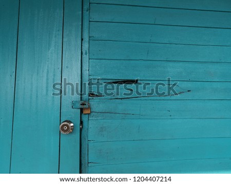 Blue wooden door and blue door of the building.