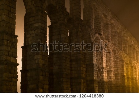 photo of the aqueduct of segovia in December 2012 with an intense fog that crossed it