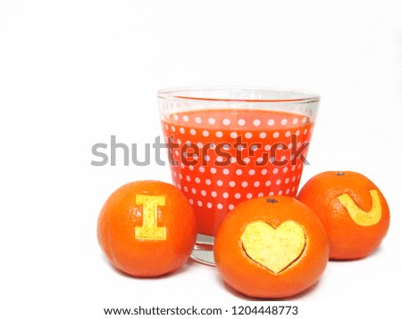 Glass of orange juice and fresh orange carve a symbol of â€œI Love Youâ€ isolated on white background. 
                             