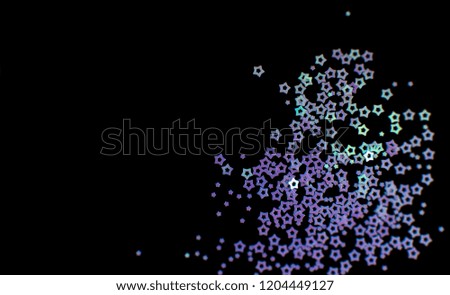 Purple and turquoise stars on a black background, top view. Copy space for text. Perfect for night party, christmas or new year invitation, or as festive background