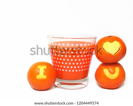 Glass of orange juice and fresh orange carving a symbol “I Love You” isolated on white background.
                               