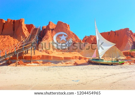 Canoa Quebrada cliffs, staircase and sail boat Royalty-Free Stock Photo #1204454965