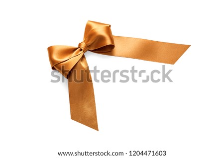 Golden bow on a white background. Preparation for a festive design.