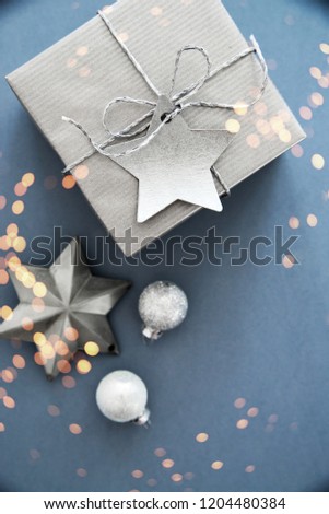 Christmas silver handmade gift boxes on blue background top view. Merry Christmas greeting card, frame. Winter xmas holiday theme. Happy New Year. Flat lay