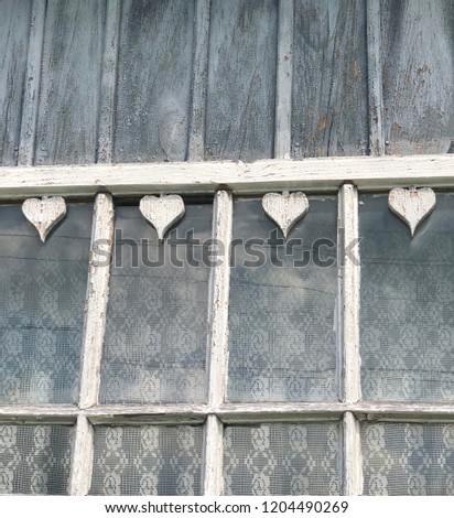 Heart shaped wooden decoration detail on an old house in  rural Rzeszow, Poland.