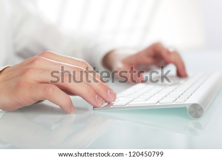 hand  typing on a keyboard Royalty-Free Stock Photo #120450799