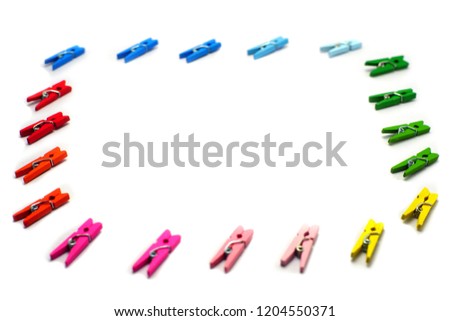 Colorful wooden clothespins on white background