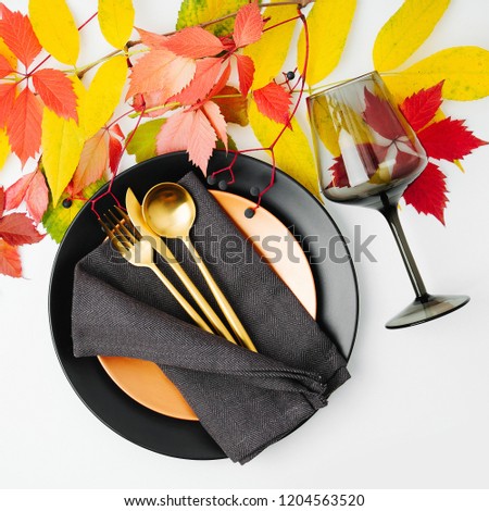 Festive table setting with Bright Autumn leaves on white background. Flat lay, top view