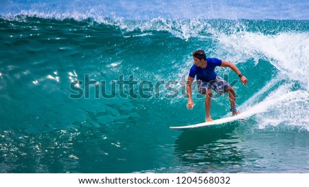 Riding the waves. Costa Rica, surfing paradise Royalty-Free Stock Photo #1204568032