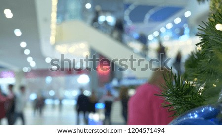 concept of holiday shopping. Blur the hall in the shopping center with Christmas decorations.