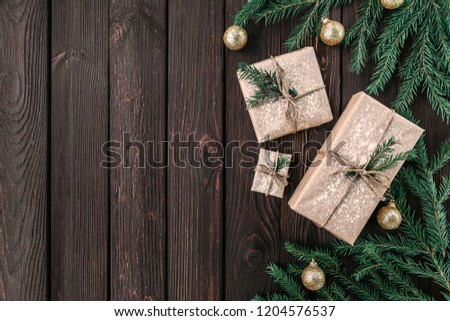 Christmas fir tree with decoration on a wooden board. Copy space for text