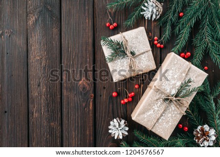Christmas fir tree with decoration on a wooden board. Copy space for text