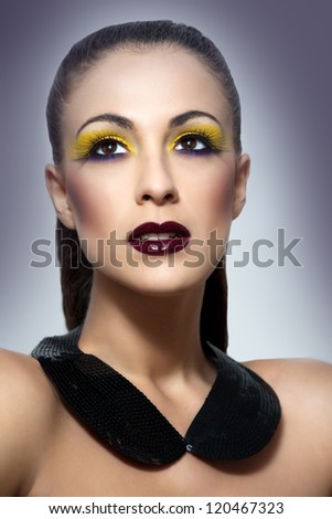 Beautiful woman with a bright make up. Fashion photo.