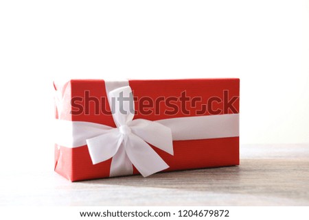 A studio photo of a gift wrapped present