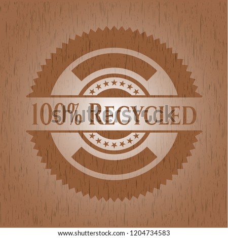 100% Recycled badge with wooden background