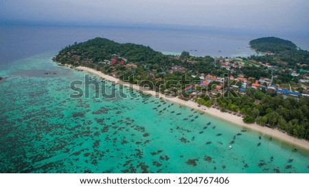 Koh Lipe Thailand. Paradise Island with Blue Sea and there are many ships on the sea. Coral complete White sand beach on Koh Lipe island,South Thailand.High-angle photography using drone.