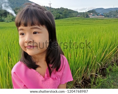 
Girls wear pink On a natural green background