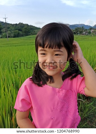 
Girls wear pink On a natural green background