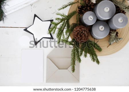 Christmas card mockup on wooden desktop