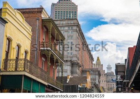 The French Quarter in New Orleans is historic and famous for its vibrant nightlife and colorful buildings with cast-iron balconies.