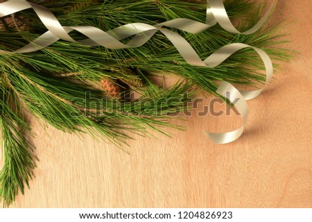 Christmas background, green pine branches and Christmas decorations, space for text.