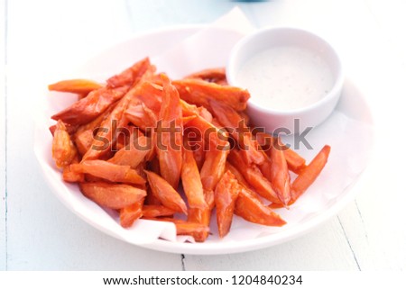 Potato cut fried. Potato wedges are wedges of potatoes, often large and unpeeled, that are either baked or fried. They are sold at diners and fast food restaurants.