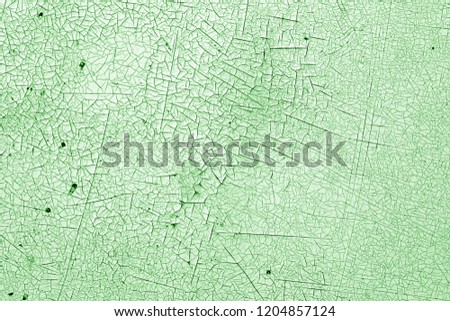 Crack and damage on painted texture in green tone. Abstract background and texture for design.