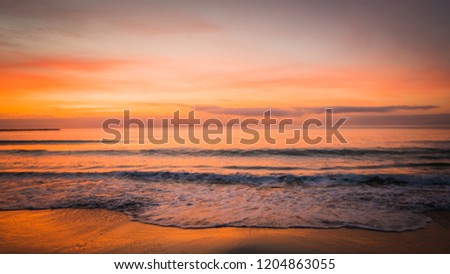A gorgeous perfect landscape that features the waves of the Mediterranean Sea at sunrise. The photo was taken in the seaside town of Cullera, a famous touristic seaside town in Valencia, Spain, Europe