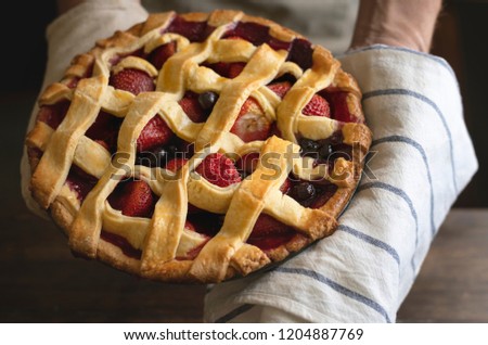 Homemade mixed berry pie food photography recipe idea Royalty-Free Stock Photo #1204887769