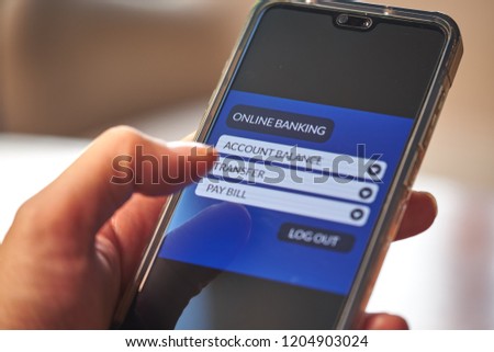 Online banking & internet banking concept. Male hands using smartphone for personal financial transaction on mobile banking app. Front view & close up. All screen graphics are made up with own design
