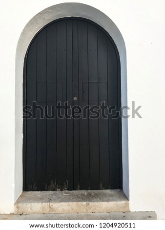 Wooden vintage doors in wall of an old building. Studio Photo