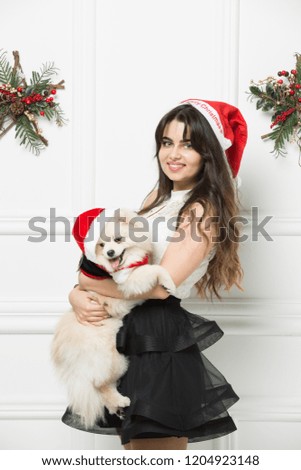 Santa girl with santa dog, merry christmas wishes,happy new year, merry christmas image
