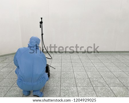 Inspector are testing dust inside the operating room with Particle Counter. Royalty-Free Stock Photo #1204929025