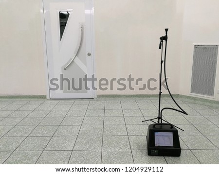 Testing dust inside the operating room with Particle Counter. Royalty-Free Stock Photo #1204929112