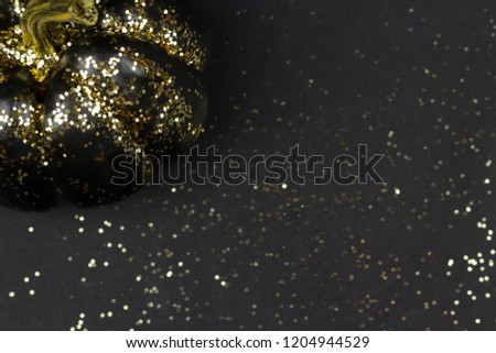 Black pumpkin and gold shiny glitters