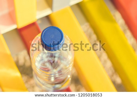 Plastic bottle in nature contaminates